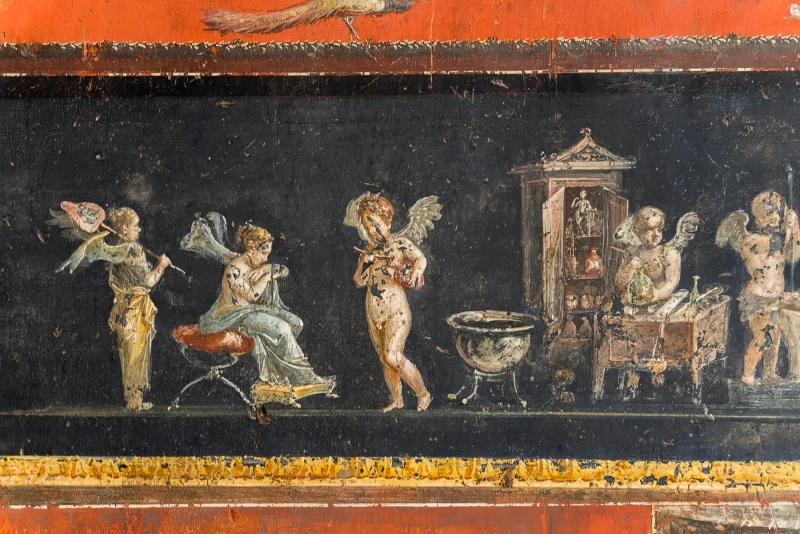 Friso de cupidos fabricando aceite perfumado en la Casa de los Vettii de Pompeya